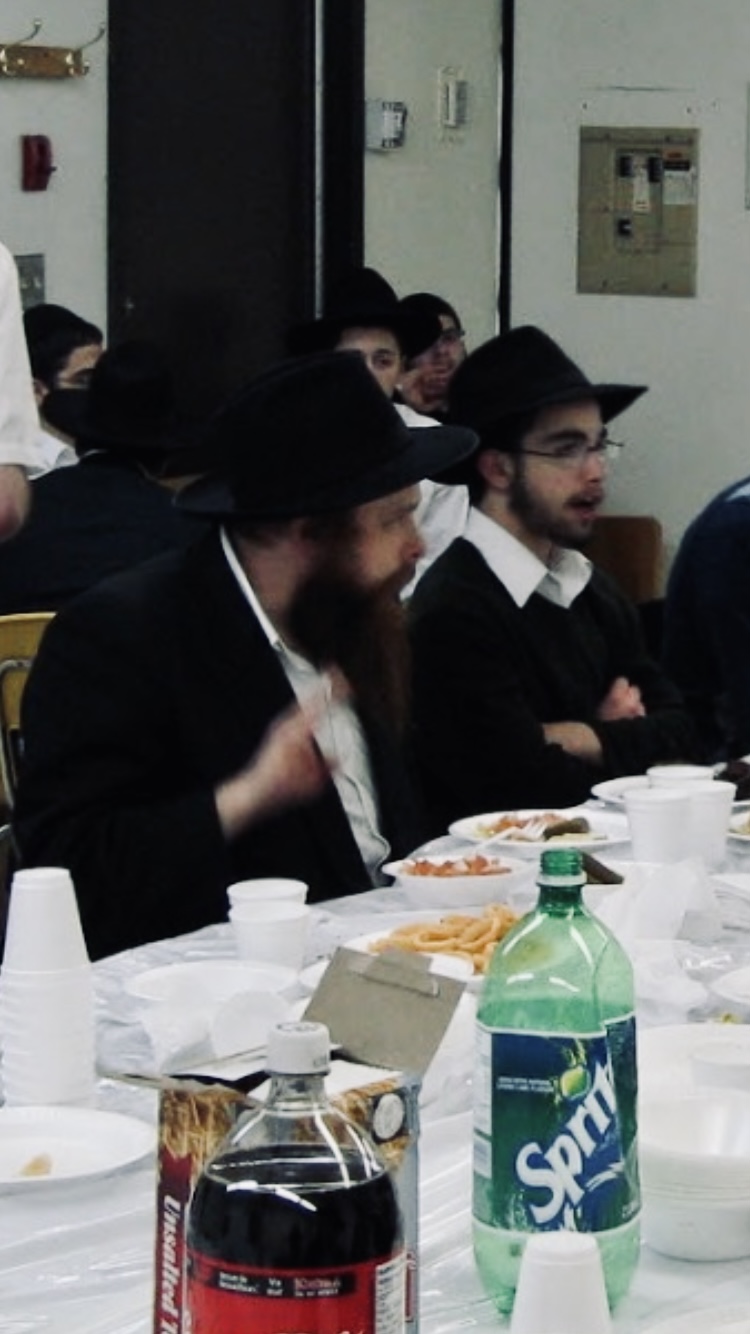 Sitting next to Rabbi Wagner during a Farbrengen in Yeshiva